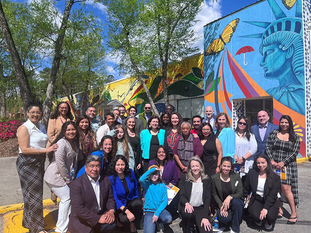 OCR Director Melanie Fontes Rainer pictured with North Carolina community members at El Futuro.